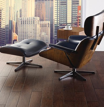 mid-centry leather chair on top of hardwood flooring