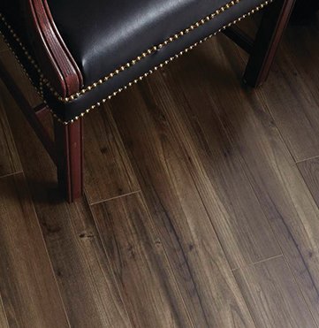 black leather chair on laminate flooring
